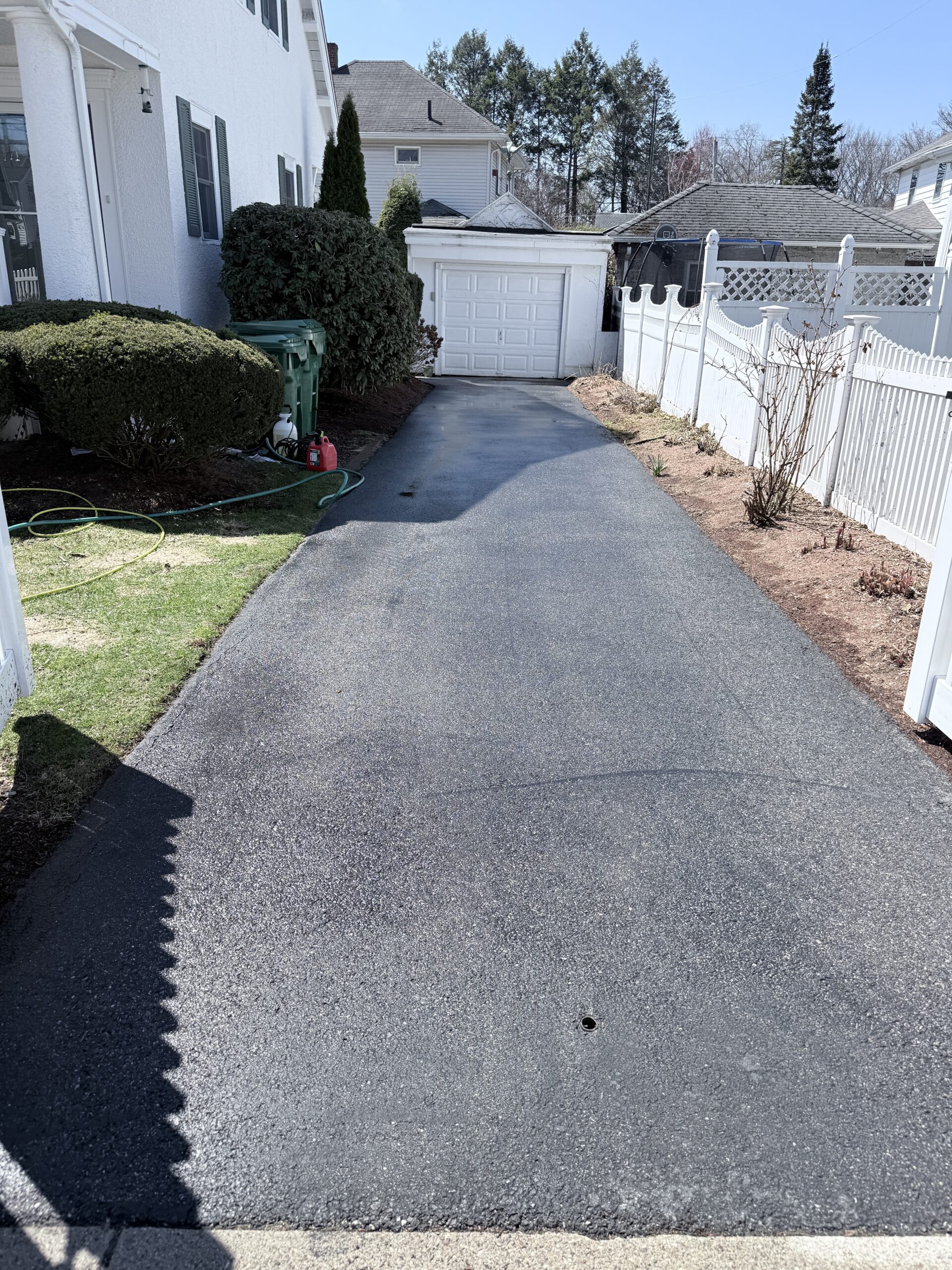 Clean residential driveway after professional pressure washing service in Cambridge, MA