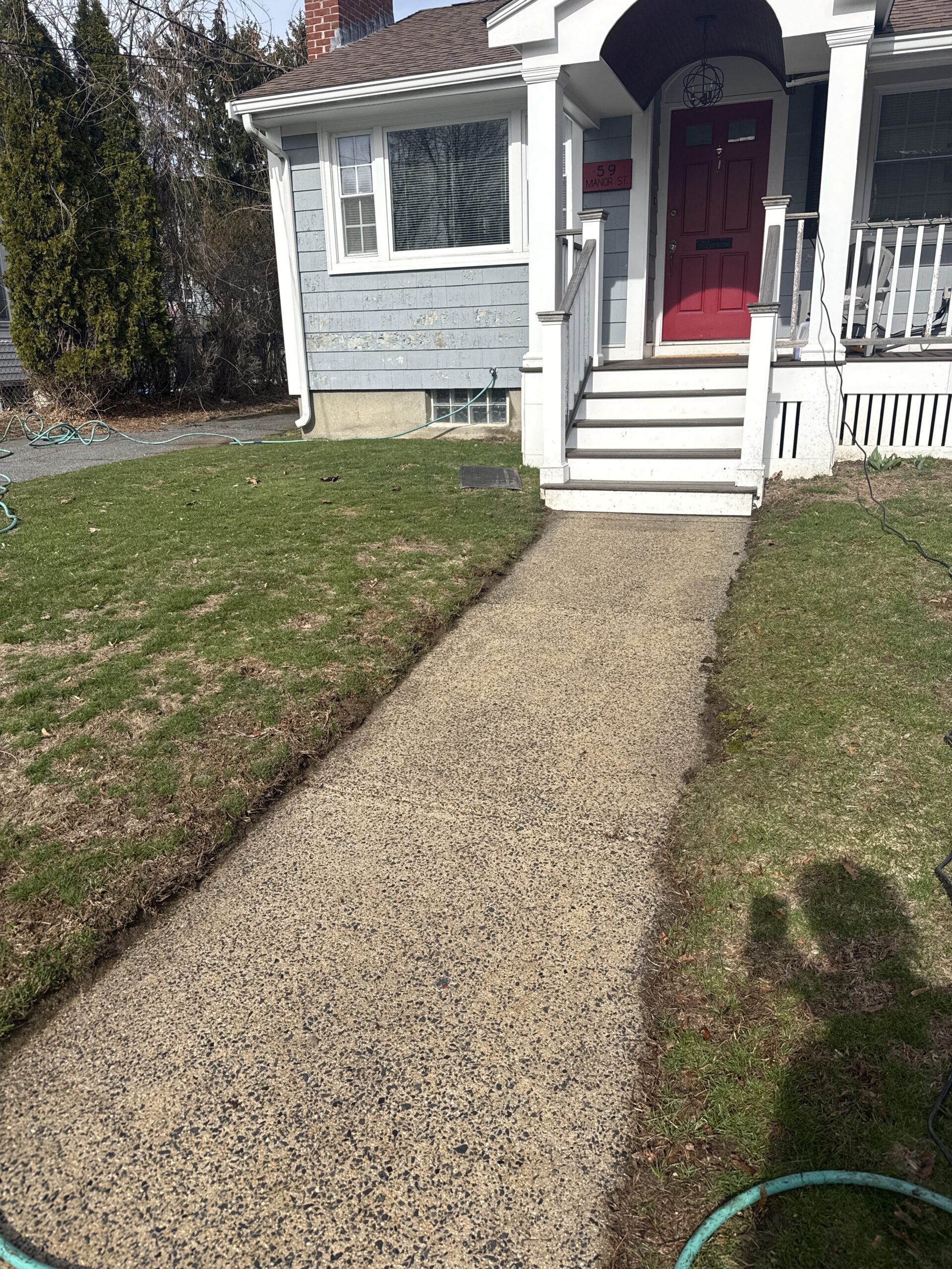 Freshly cleaned stone walkway improving the entrance of a Greater Boston home