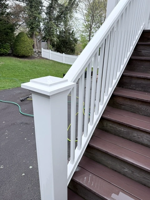 Freshly pressure-washed stairs with a clean, restored surface