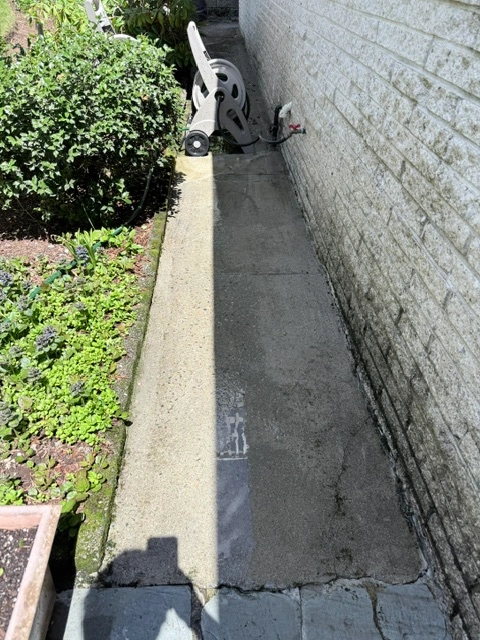 Soft washing a house exterior to remove mold, dirt, and organic buildup in Quincy, MA